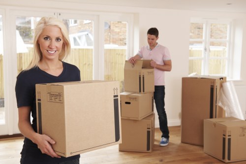 Removal team loading household furniture in Enfield