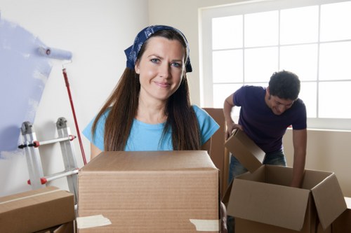 Careful packing of fragile household items for an Enfield move