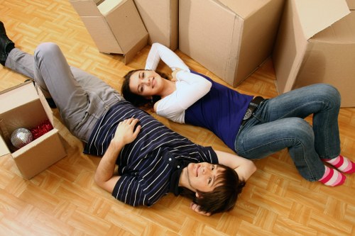 Careful handling of heavy items during an Enfield moving service
