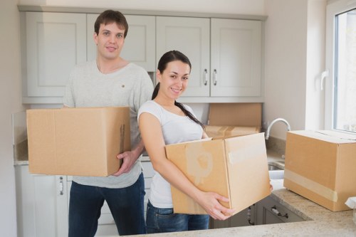 Loading furniture into a van for a move in Enfield